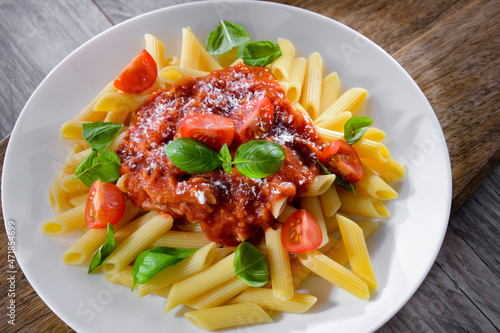 Composition with a plate of pasta penne rigate