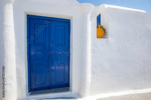 Beautiful details of the island of Santorini, white houses, blue doors and sh...