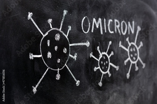 Variante del virus covid 19, omicron,  dibujado en una pizarra con tiza photo