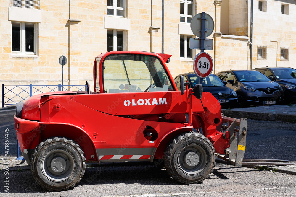 Loxam rental forklift company with brand text and logo sign of red rent