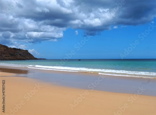 Cloudy Burgau beach in the Algarve region of Portugal photo