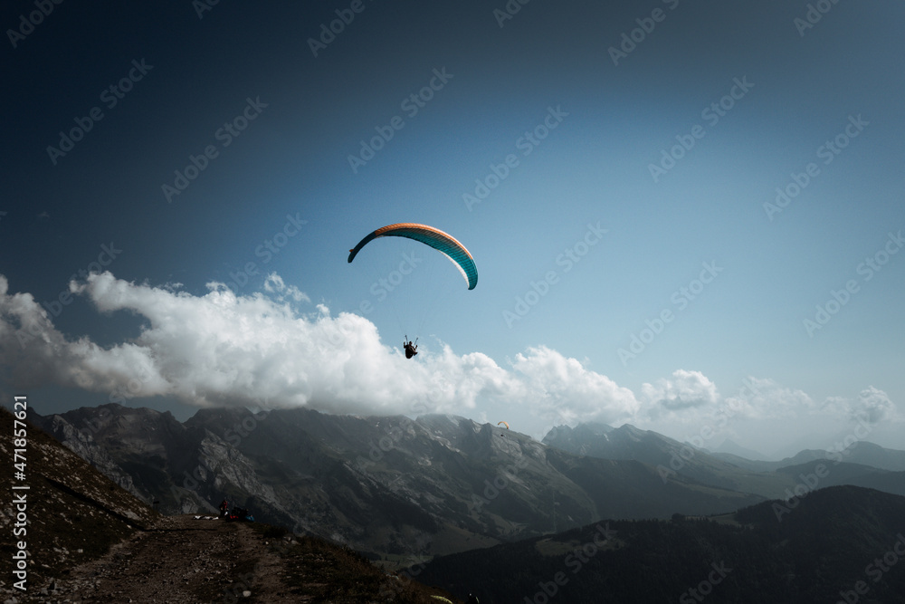 paragliding flight in the mountains. Le Grand-Bornand, France paragliding flight in the mountains. Le Grand-Bornand, France