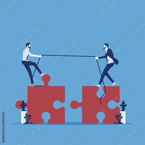 Teamwork vector concept, two business people pull jigsaw puzzle pieces into position demonstrating teamwork