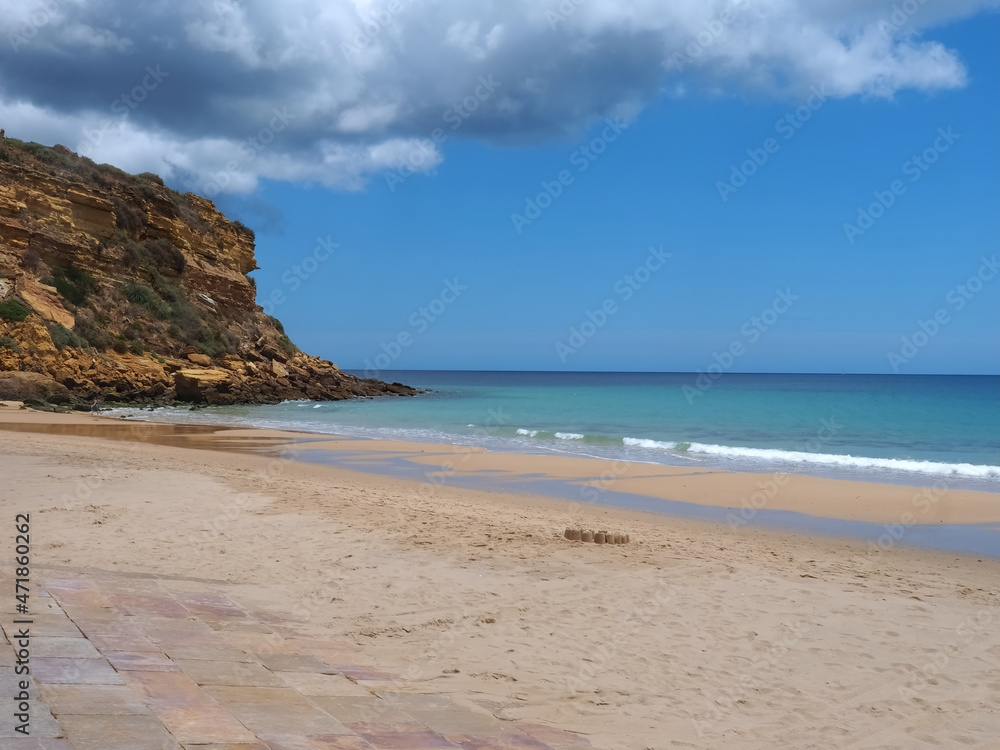 Cloudy Burgau beach in the Algarve region of Portugal Cloudy Burgau beach in the Algarve region of Portugal