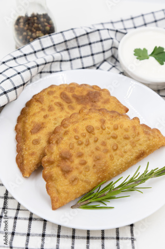 Delicious cheburek with meat. East cuisine meat pastry.