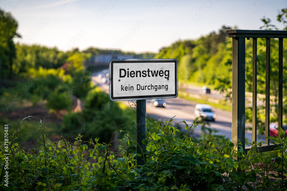 Sign: Dienstweg kein Durchgang (German for: Service path, no passage), seen near the motorway in Ratingen, North Rhine-Westphalia, Germany
