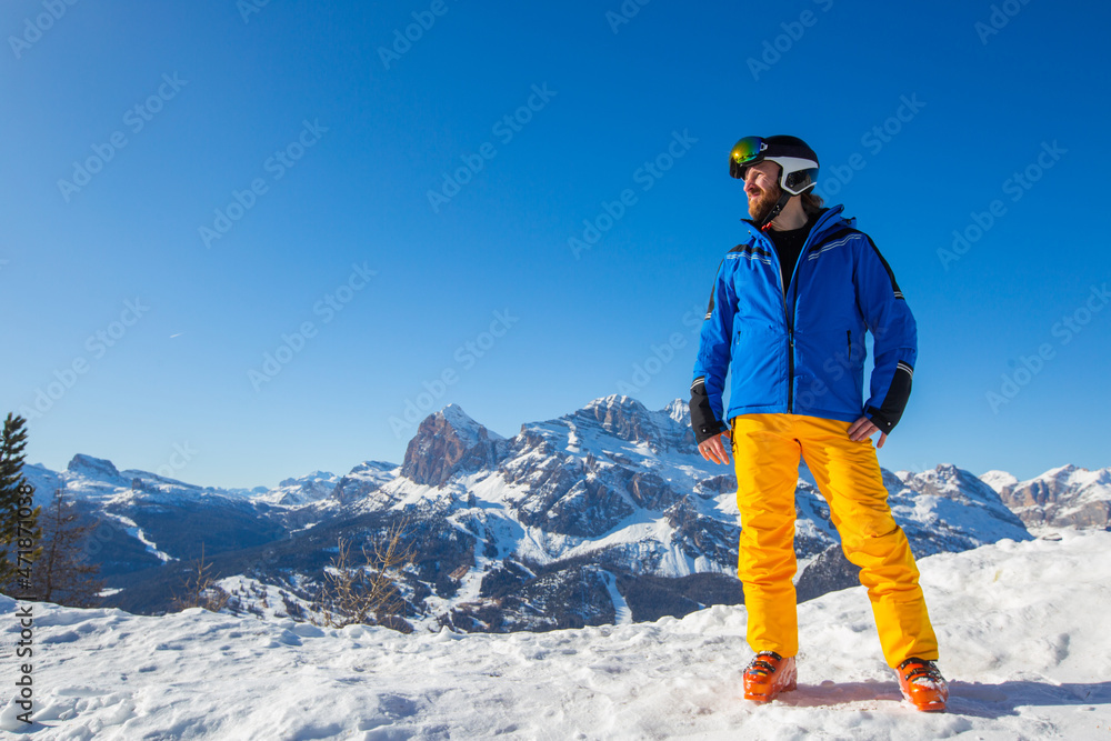 Happy skier on slope at Cortina