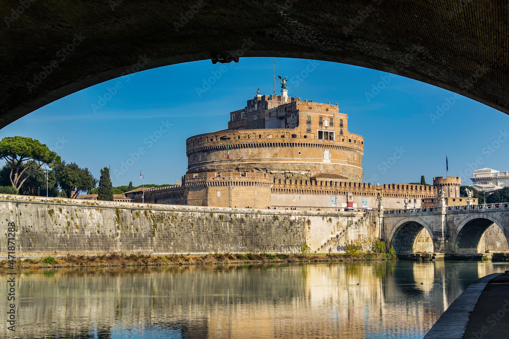 A view of the Castel Sant'Angelo (Castle of the Holy Angel) and the Ponte Sant'Angelo (Bridge of Hadrian) on Tiber river as seen from under the Ponte Vittorio Emanuele II in Rome, Italy