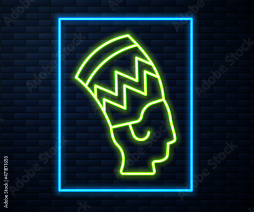 Glowing neon line Nefertiti icon isolated on brick wall background. Vector