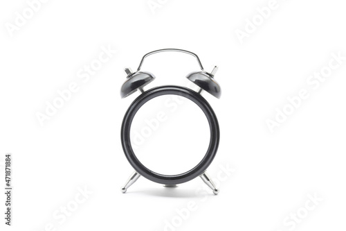 Black classic desk clock without dial on isolated white background with shadow. 