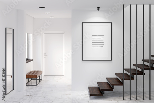 Print op canvas White minimalist lobby with the illuminated vertical poster above the stairs, black-framed mirror, marble floor