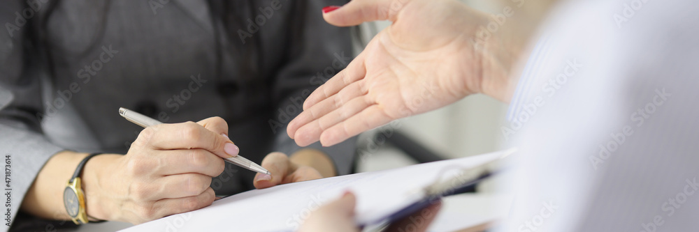 Businesswoman hands partner contract for signature closeup Businesswoman hands partner contract for signature closeup