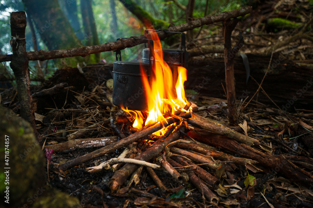 cooking in the forest,Blackened camping pots and a cauldron out of the fire. It's spring cooking in the forest,Blackened camping pots and a cauldron out of the fire. It's spring