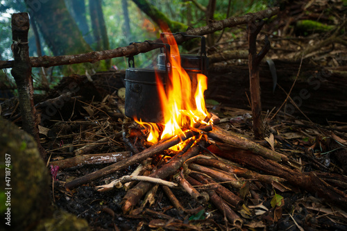 cooking in the forest,Blackened camping pots and a cauldron out of the fire. It's spring