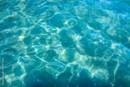 Blue-green in the light of the sea water.