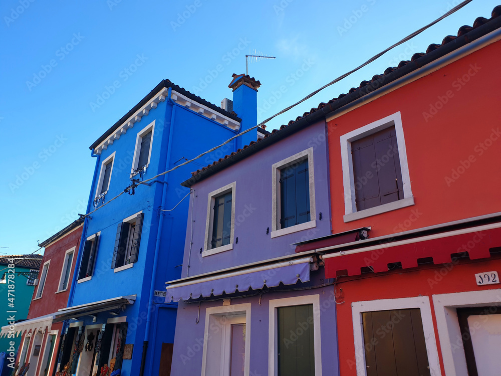 Colorful painted houses facade on Burano island, province of Venice, Italy