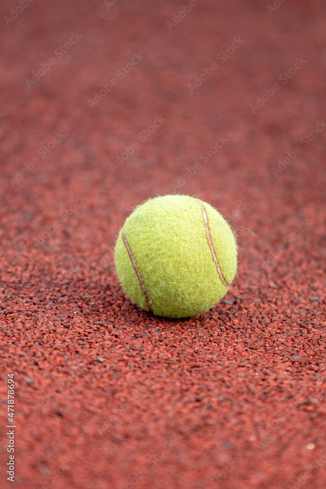 Tennis ball on the map, close-up.