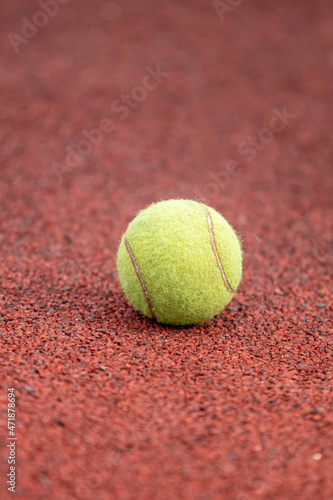 Tennis ball on the map, close-up. © Prikhodko