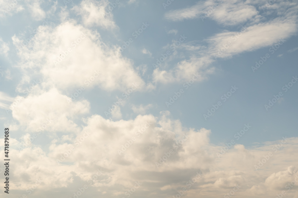 White clouds against the blue sky. Sky concept with clouds.