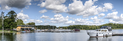 Obraz na płótnie Boats, yachts and blue water - this is the marina of the city Fürstenberg on the Havel, which is surrounded by lakes and therefore bears the name German water city