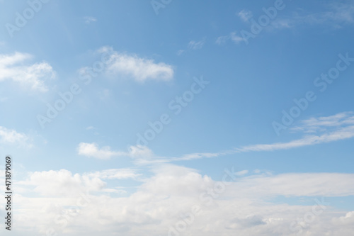 White clouds against the blue sky. Sky concept with clouds.