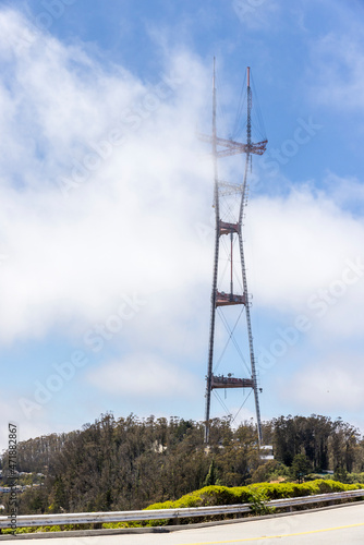 Radio towers reaching into the clouds seen from Twin Peaks drive photo