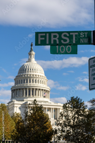 Sign of first street in Washington DC. Capitol building in background.
