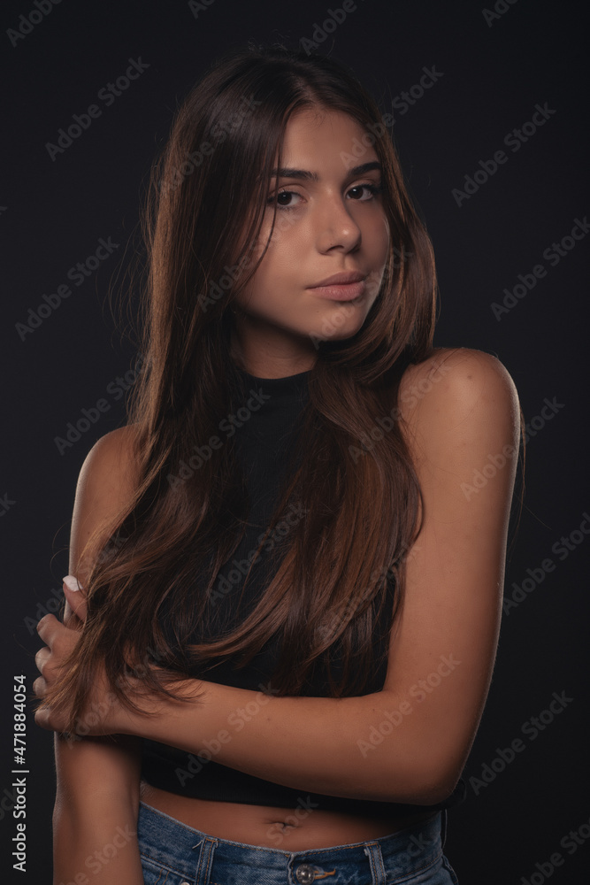 Portrait of girl posing while having a small smile Portrait of girl posing while having a small smile