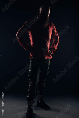 Silhouette of a beautiful strong nordic man with stylish hairstyle and beard on a isolated background. © qunica.com