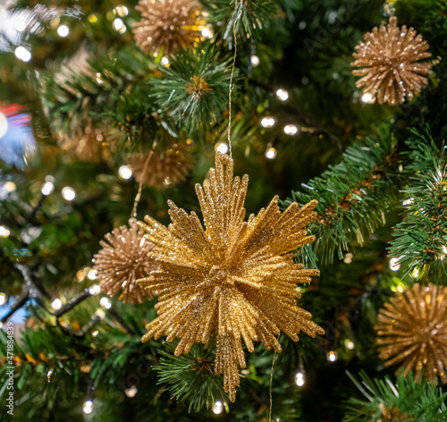 Beautiful Christmas tree in gold and red toys