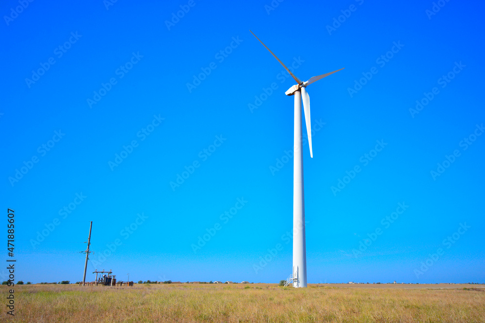 Wind power generation. Wind turbine in a field. Wind power generation. Wind turbine in a field.