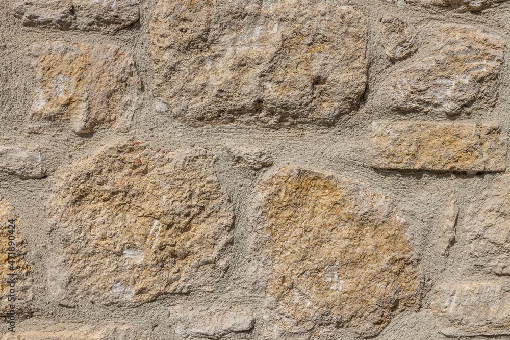 Close up view of wall structure of natural stones typical for mountainous regions.