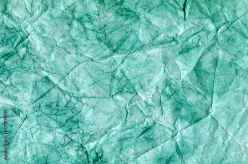 watercolor of delicate white-green emerald color with a textured background. crumpled paper.