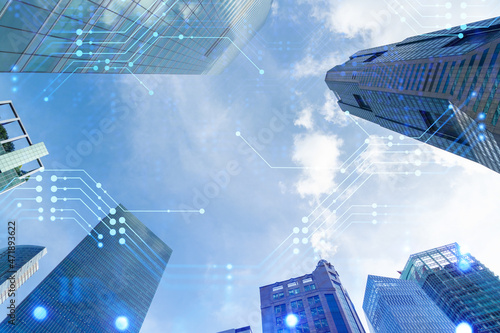 Photography Technology hologram over low angle shot of Singapore skyscrapers