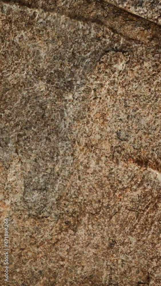 A close-up video from above a lake with very clean transparent fresh water, through which you can see the bottom of the lake made of stones A close-up video from above a lake with very clean transparent fresh water, through which you can see the bottom of the lake made of stones