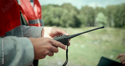 A man is using Talkie-walkie