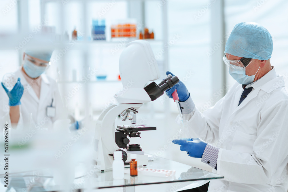 close up. virologists work in the laboratory . close up. virologists work in the laboratory .