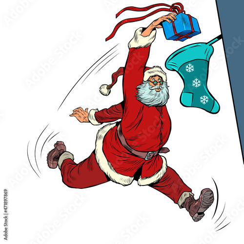 Santa Claus throws a gift into a Christmas sock, like a basketball player throws a ball into a basket. Christmas and New Year, winter seasonal holiday in December