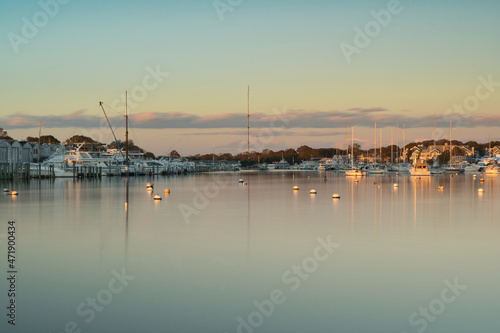 Multiple Boats, Docks, Buoys with smooth water and a clear sky © Tyler