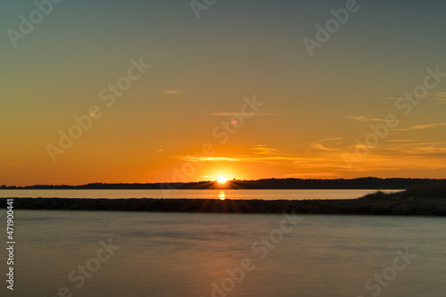 Sunset with Sunrays cresting over the Horizon