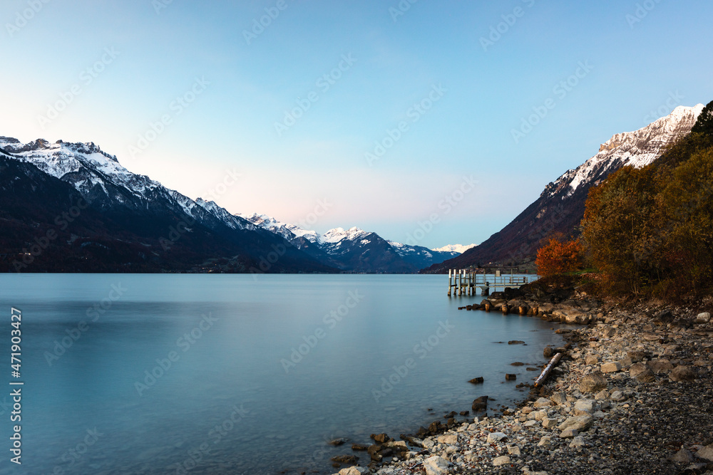 panoramic view of Lake Brienz in Switzerland with pier and autumn colors