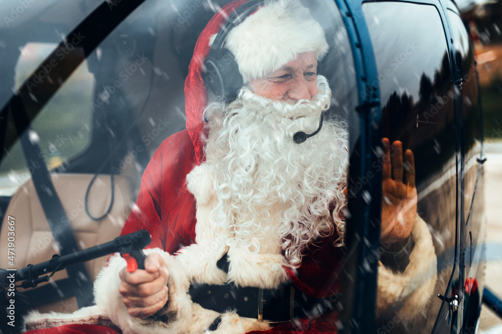 Santa Claus drives a heliopter and delivers gifts to children around the world.