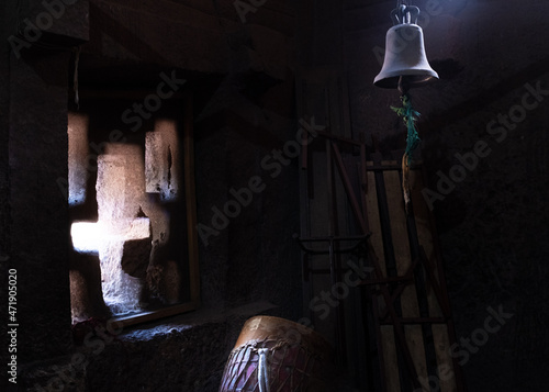 A typical window of a church and a bell, Lalibela, Ethiopia