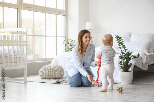 Adorable baby girl playing ...