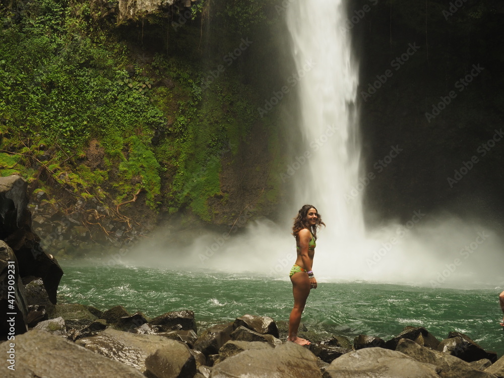 young woman hiking in the jungle in costa rica