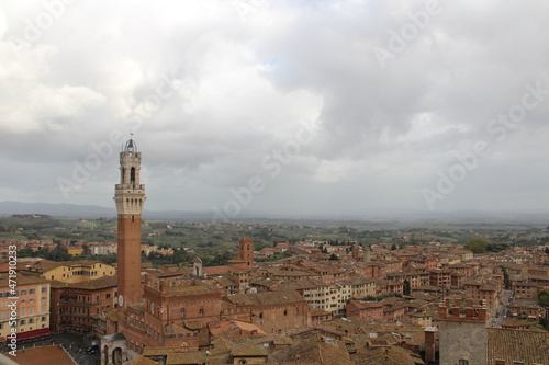 Panorama dal Facciatone, panoramic view of Siena, Italy of church facade, and centuries-old towers & piazzas.