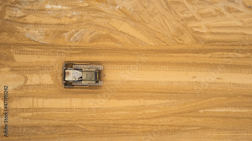 Bulldozer that mining sand. Aerial view