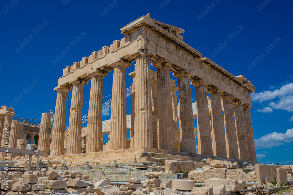 view of the Parthenon temple on a bright day with blue sky. Classical Greek heritage.