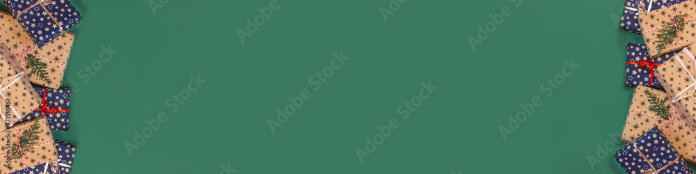 banner with many festive gift boxes on green background with copy space top view. concept of presents, holidays, festive, christmas, shopping and sales banner with many festive gift boxes on green background with copy space top view. concept of presents, holidays, festive, christmas, shopping and sales
