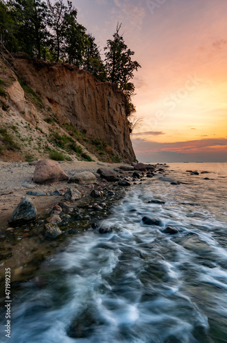 Baltic sea coast, beach and cliffs at Gdynia Orlowo during sunrise, Poland